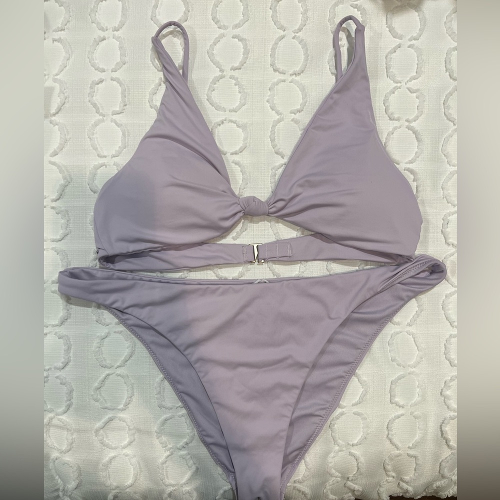 O’Neille bikini NWOT. Medium top and large bottoms.